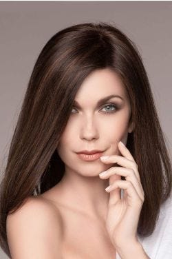 Woman in a past the shoulders dark brown straight human hair wig