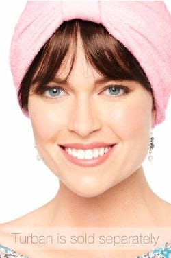 Woman in auburn brown detachable synthetic bangs worn under a turban