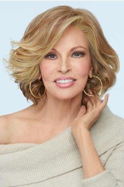 Raquel Welch in a shoulder length light auburn layered curly lace front wig