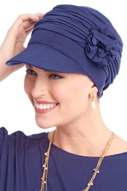 Pleated bamboo chemo hat with brim and side flower in midnight blue