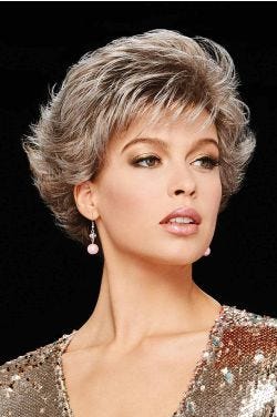 Woman in a swept back light brown and grey pixie wig with more volume on top