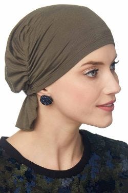 Woman in brown chemo beanie for women with cancer