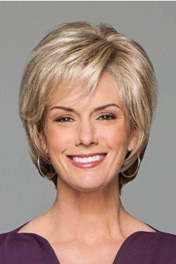 Woman in blonde, cropped bob wig with longer layers at the back and a side part