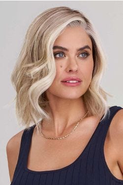 Woman in an auburn shoulder length blunt bob wig with curled under ends