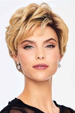 Woman in a long dark blonde layered pixie wig with side bangs