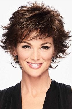 Woman in a short dark brown flipped out wig with wispy bangs