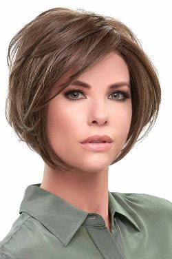 Woman in a large chin length medium brown angled lace front wig