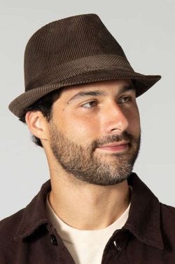 Man in brown corduroy fedora hat with small brim