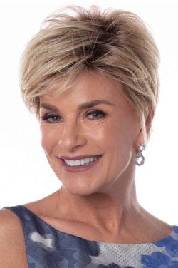 Short feathered pixie layers and side-swept bangs.