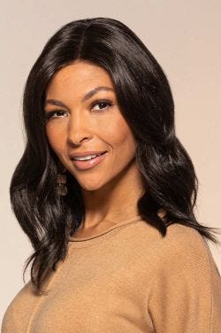Afro American woman in a past the shoulders dark brown wavy lace front wig