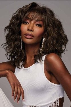 Black woman in a past the shoulders dark brown wavy layered lace front wig