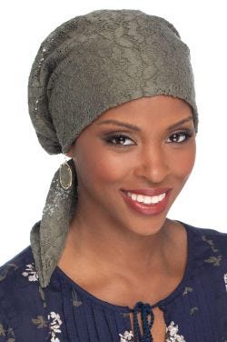 Woman in olive lace pre tied cotton head scarf for women with cancer