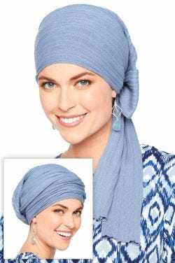 Woman in blue cotton head covering for women that wraps into different looks