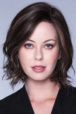 Woman in a dark brown chin length curly layered lace front bob wig
