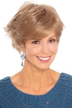 Woman in sassy, flippy, layered short blonde wig with bangs