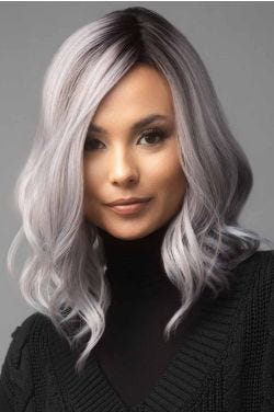 Woman in a past the shoulders lavender curly lace front wig