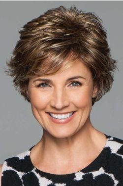 Woman in a medium brown short layered pixie bob wig with side fringe bangs