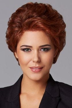 Woman in a copper red longer pixie bob wig with natural volume and a lace front