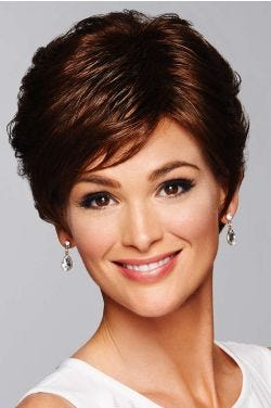 Woman in a medium length dark brown pixie wig with side bangs