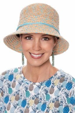 Woman in woven straw summer bucket hat