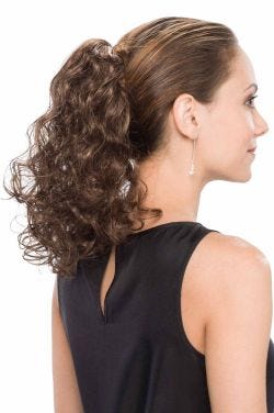 Woman in a 14" curly medium brown clip in ponytail hairpiece