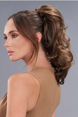 Woman in a 13" layered medium auburn clip on ponytail