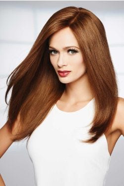 Woman in an extra long medium auburn straight wig