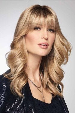 Woman in a 9.75" warm blonde hair topper with 6" fringe bangs