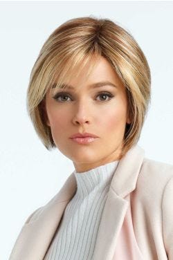 Woman in a chin length light auburn layered lace front rounded bob wig with side bangs