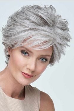 Raquel Welch in a short, choppy light auburn lace front wig
