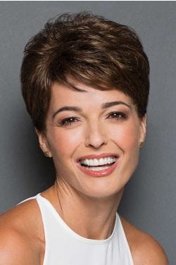 Woman in a dark brown hair topper with textured layered and side swept fringe bangs