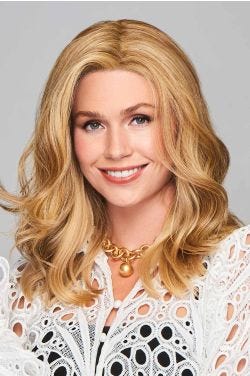 Woman in a 12" to 13" curly warm blonde hair topper for thinning hair