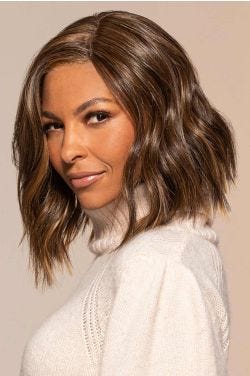 Afro American woman in a chin length medium brown wavy lace front wig