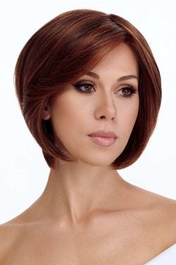 Woman in a chin length light blonde rounded bob wig