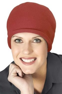 Woman in neutral knitted cotton beanie hat for cancer patients