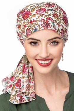 Woman in black paisley pre tied head scarf headcovering for cancer patients