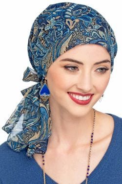 Woman in blue paisley pre tied head scarf for cancer patients