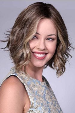 Woman in short wavy bob wig by Bell Tress in dirty blonde