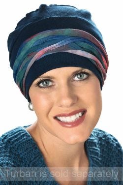 Woman in blue turban wearing multi colored headband as a hat accessory