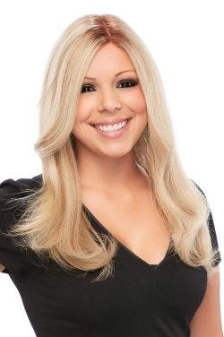 Woman in an extra long, semi-wavy light blonde lace front wig with face framing layers