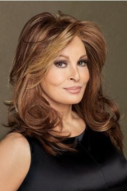 Raquel Welch in layered, past the shoulders medium auburn wig with lighter face framing layers