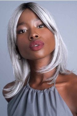 Woman in a 12" straight silver hair topper with 5" curtain bangs