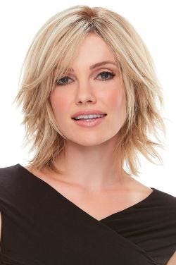 Woman in a 6" to 8" layered blonde wiglet hair topper