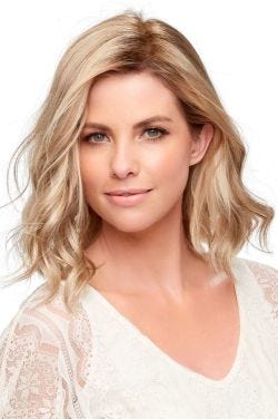 Woman in a 12" light blonde curly wiglet hair topper