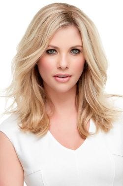 Woman in a 12" light blonde human hair topper