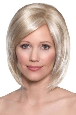 Woman in stacked bob wig with longer layers at the front, a side part, and a monofilament top