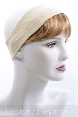Bald cancer patient in headband with detachable bangs attached