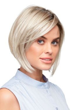 Woman in a light ash blonde angled bob wig with a side part and shorter layering along the face