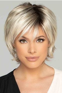 Woman in a short shaggy platinum bob lace front wig with wispy bangs