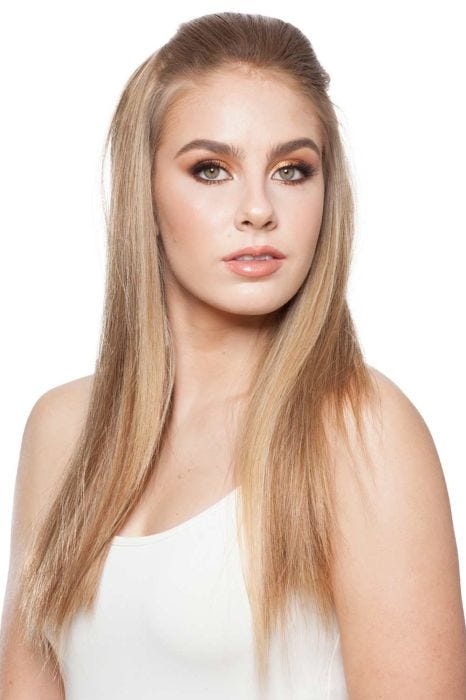 Woman in a 22" to 23" light blonde remy human hair topper for thinning hair
